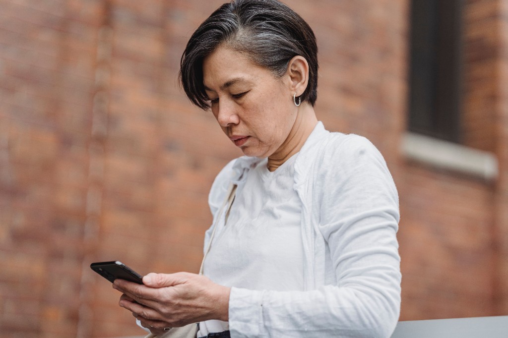 Woman preparing notes before a GP appointment