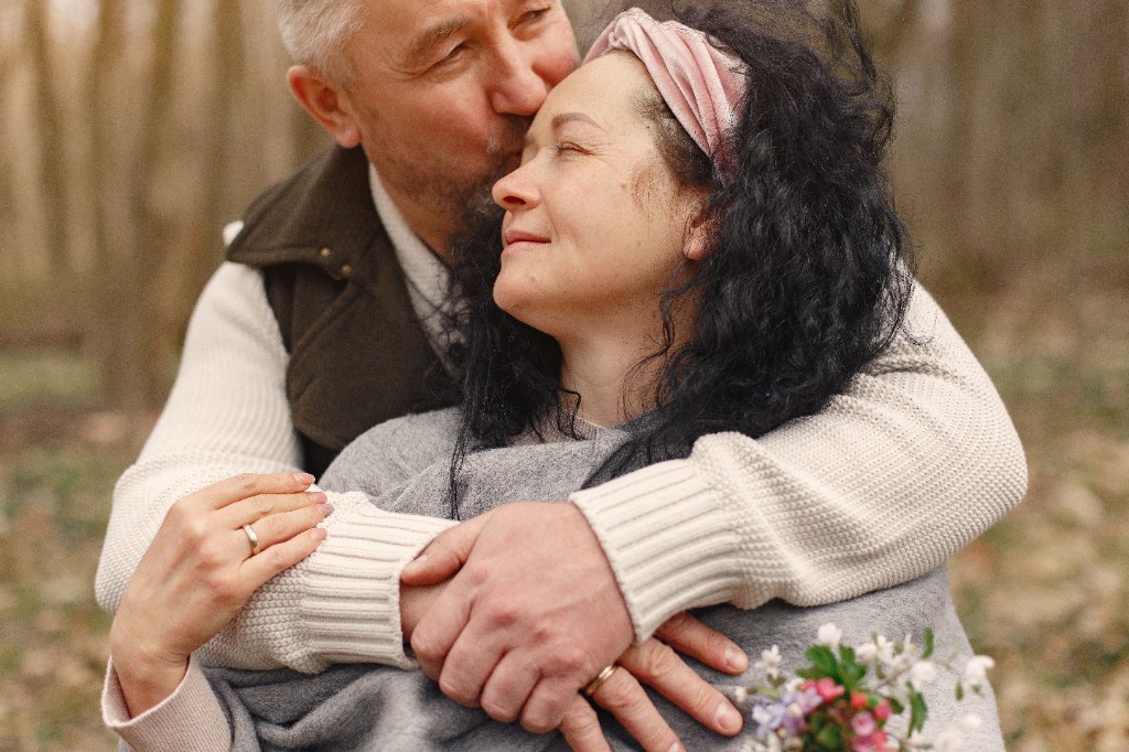 Couple sharing a quiet affectionate moment outdoors